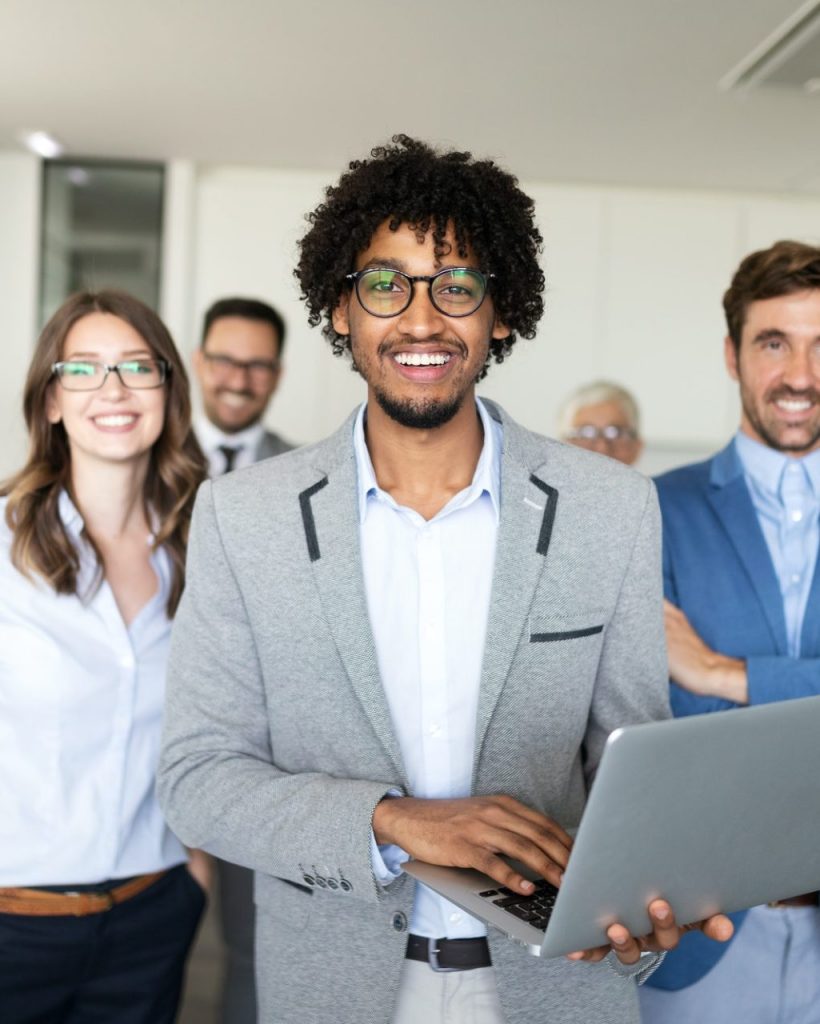 Successful team of young perspective businesspeople in office